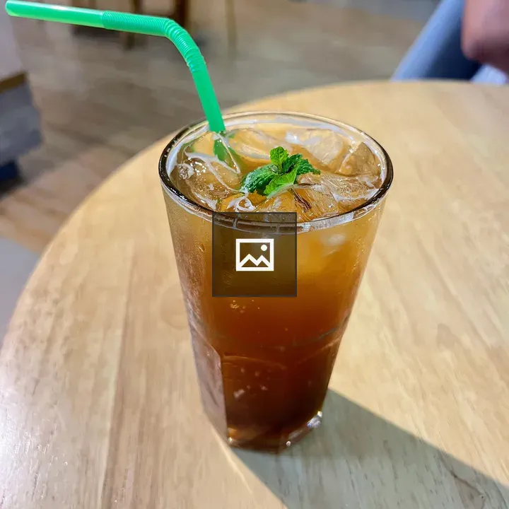 Glass of iced tea on cafe table