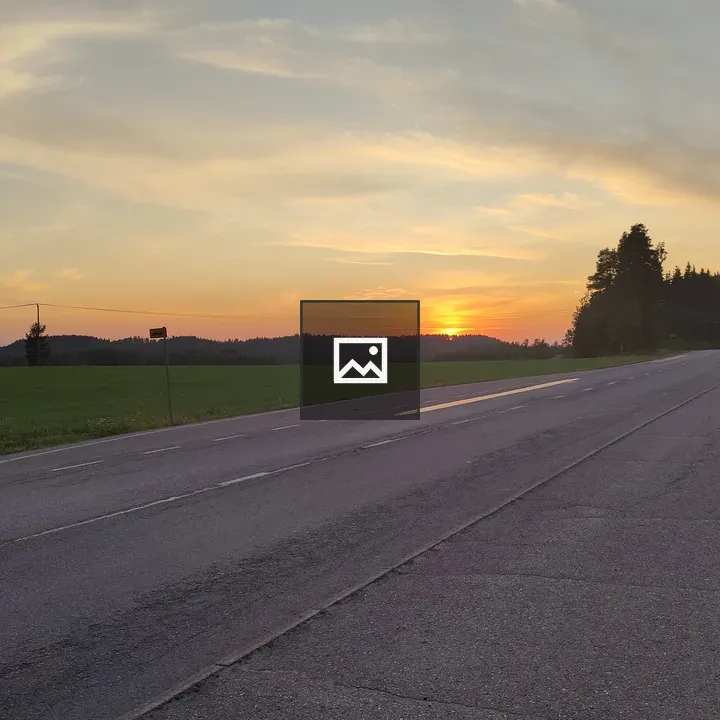 Asphalt road at sunset