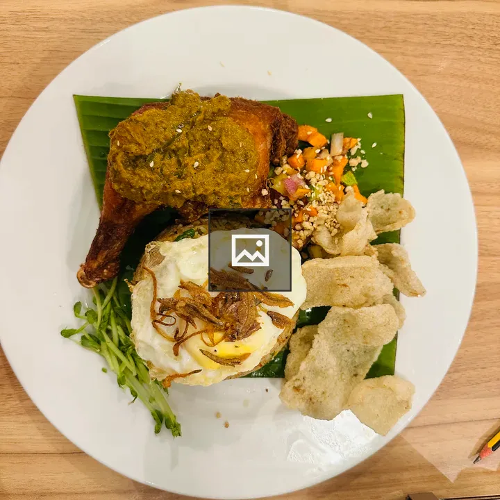 Plate with yellow rice and omelette