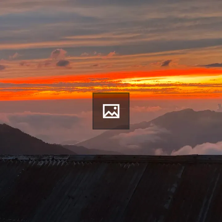 Sunset over sea of clouds and peaks