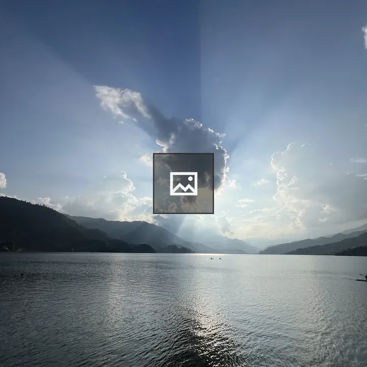 Sunlit Clouds Over Lake