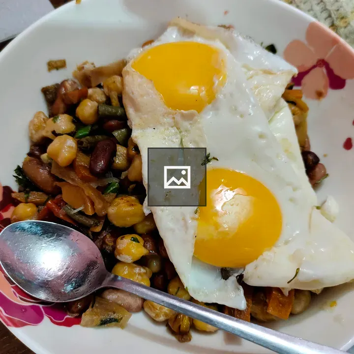 Bowl with fried egg on top