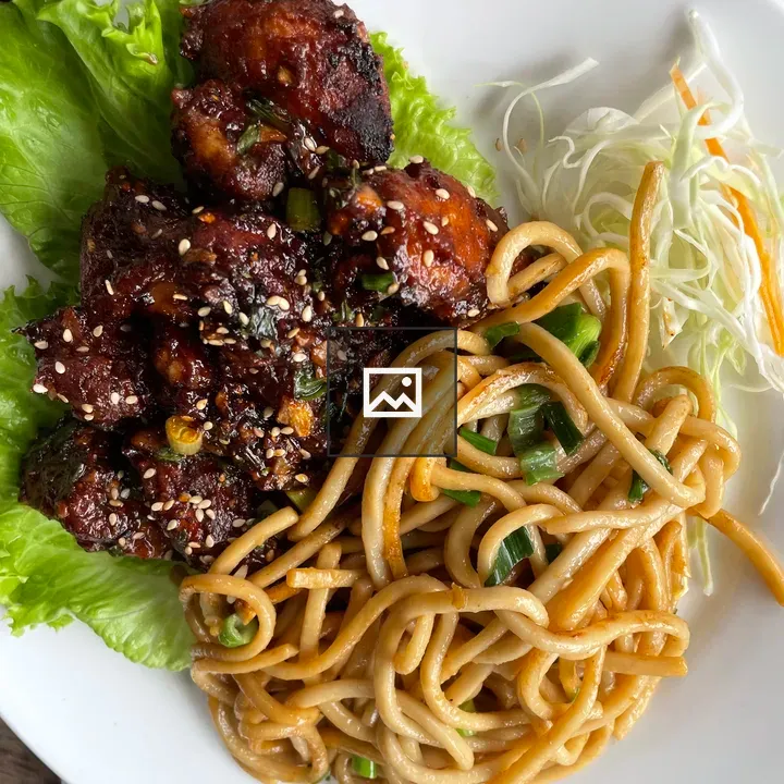 Meal on Plate with Noodles and Chicken