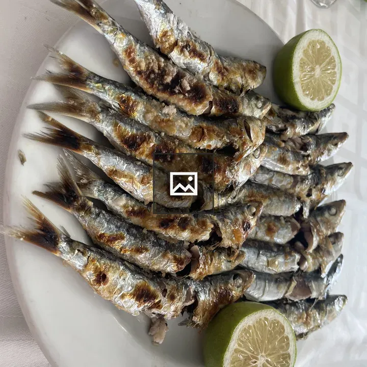 Roasted sardines on plate