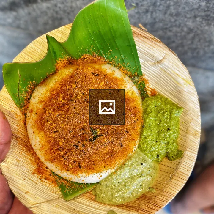 Round dosa on banana leaf