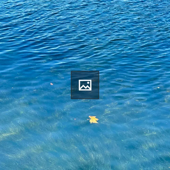Blue water with yellow leaf