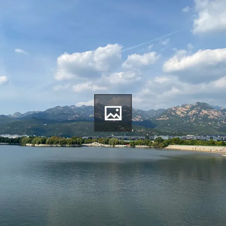 Calm Water Scene with Mountains