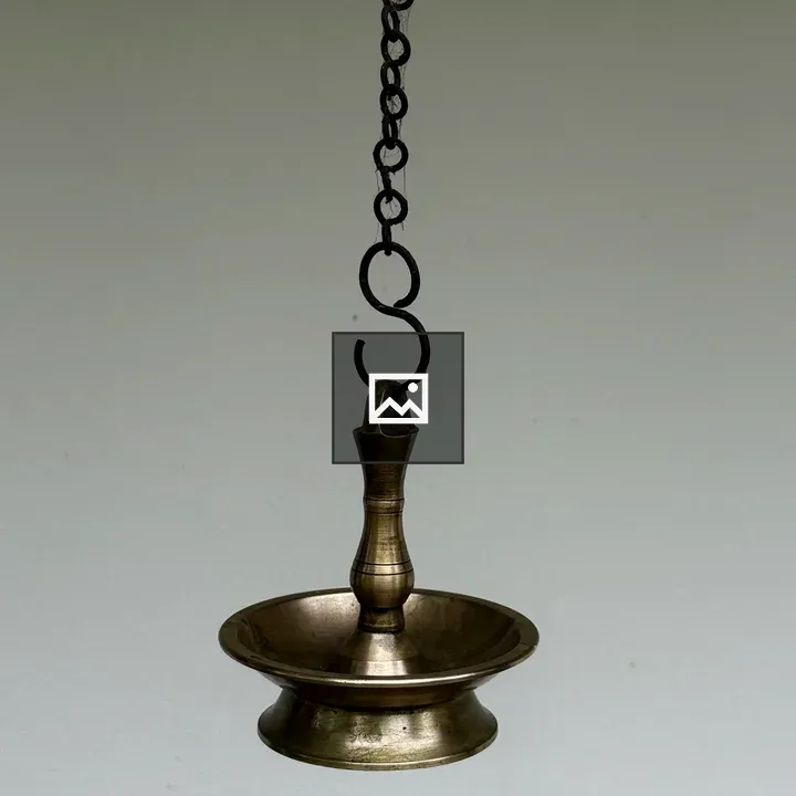 Traditional hanging brass oil lamp