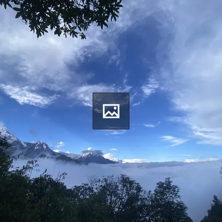 Mount Fishtail Between Clouds
