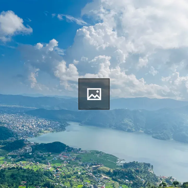 Lake and hills with city skyline