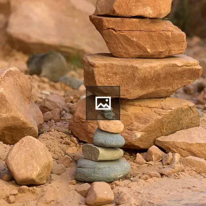 Stacked Rocks In The Dirt