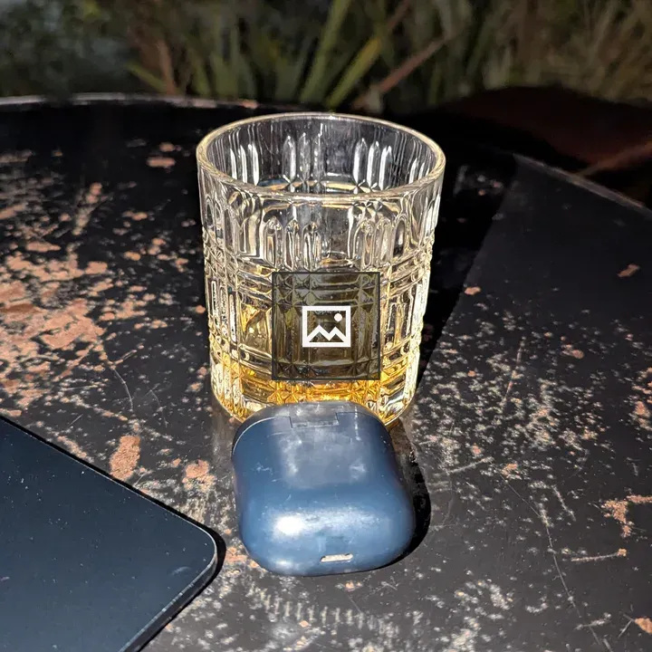 Drink in a whiskey glass on wood