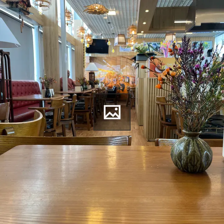 Interior restaurant with wooden tables