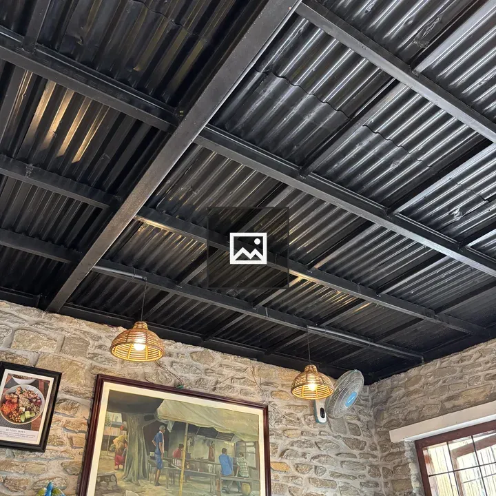 Corrugated Metal Ceiling and Stone Interior