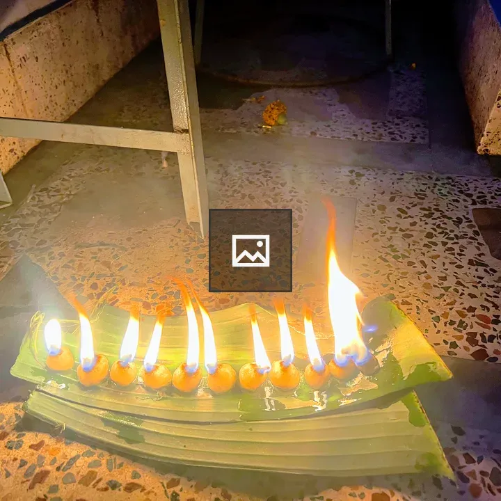 Row of Oil Lamps on Banana Leaves