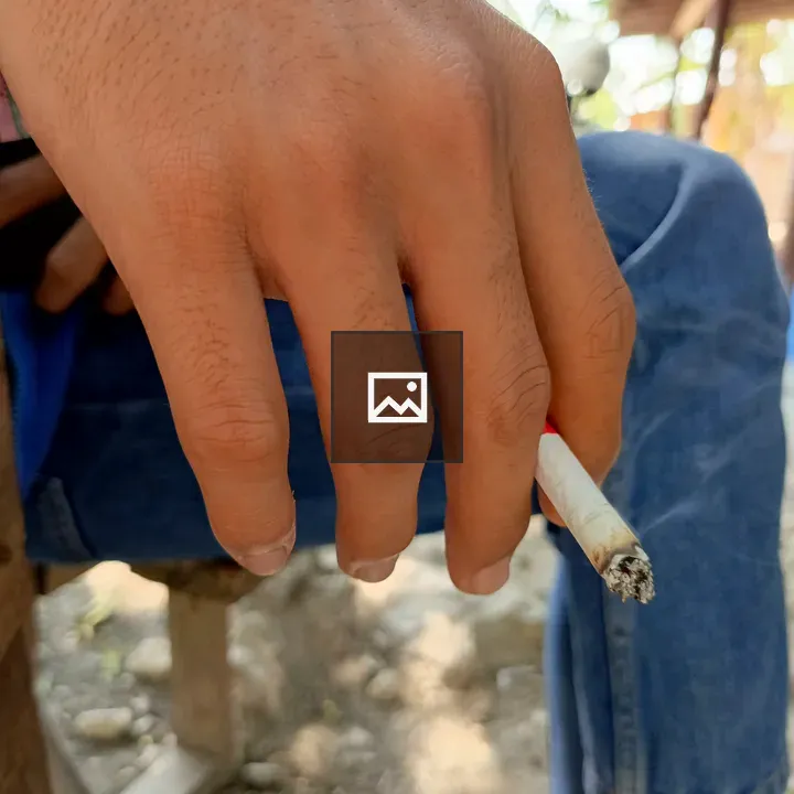 Hand holding a cigarette