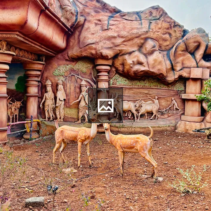 Sculpted village diorama with deer