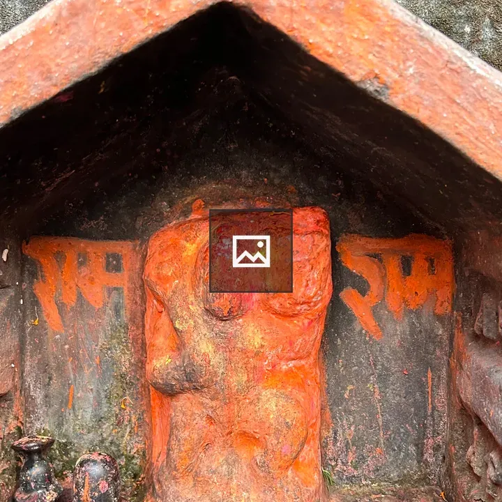 Small shrine carving on stone wall