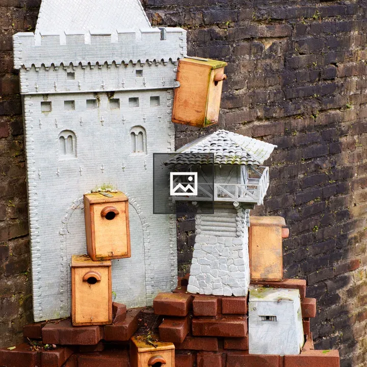 Bird houses on brick wall