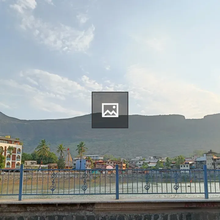 Town by the water with mountains