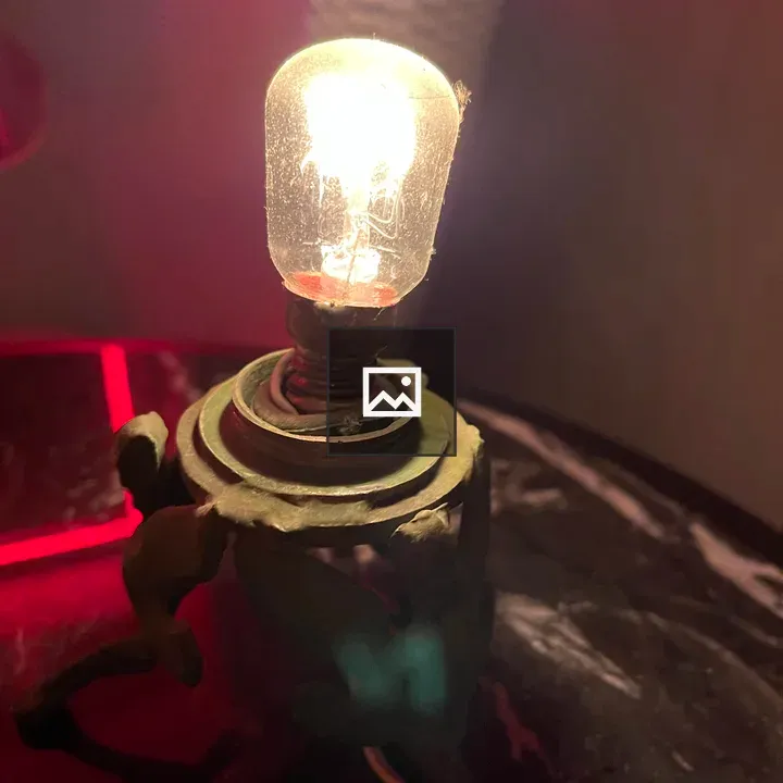 Antique lamp with replacement bulb