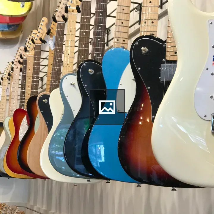 Row of colorful hanging guitars