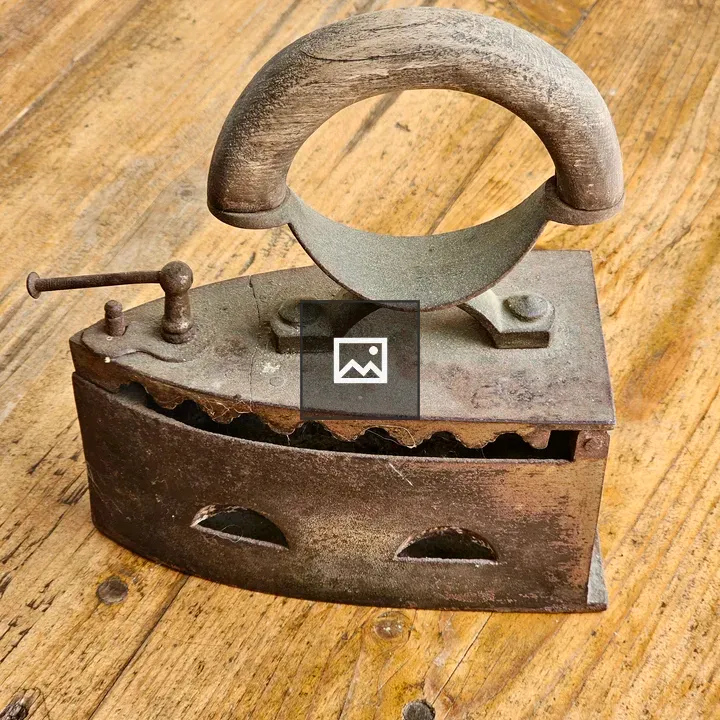 Vintage coal iron with wooden handle