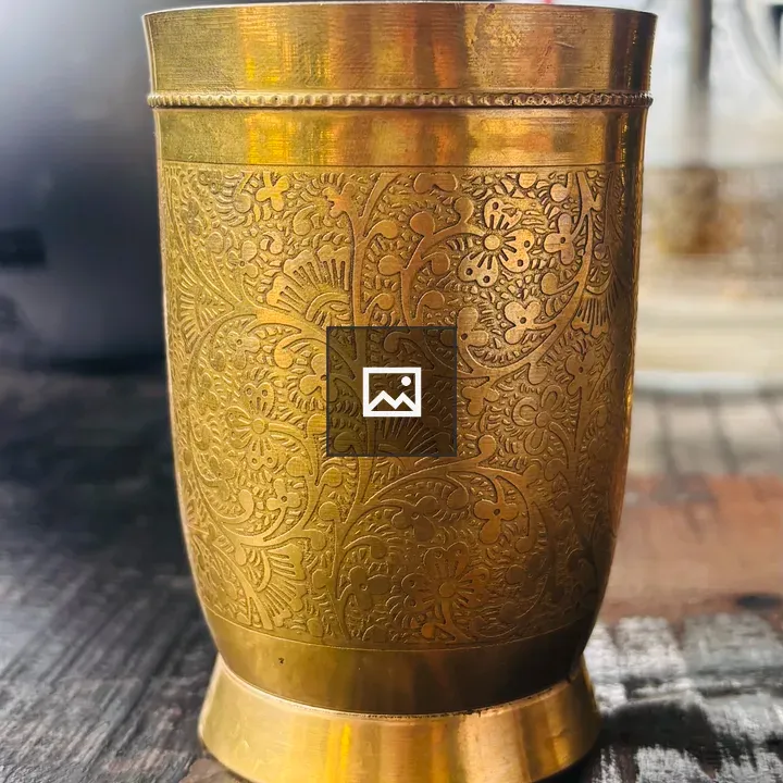 Ornate brass cup