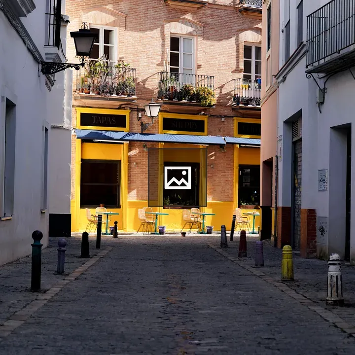 Bright yellow cafe at street end