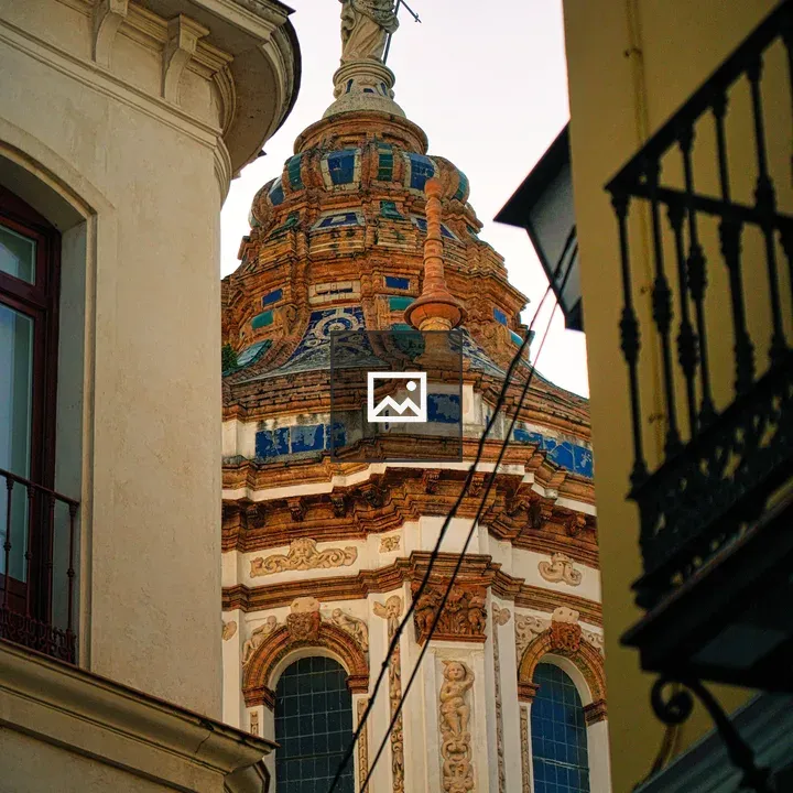 Colorful church dome between buildings