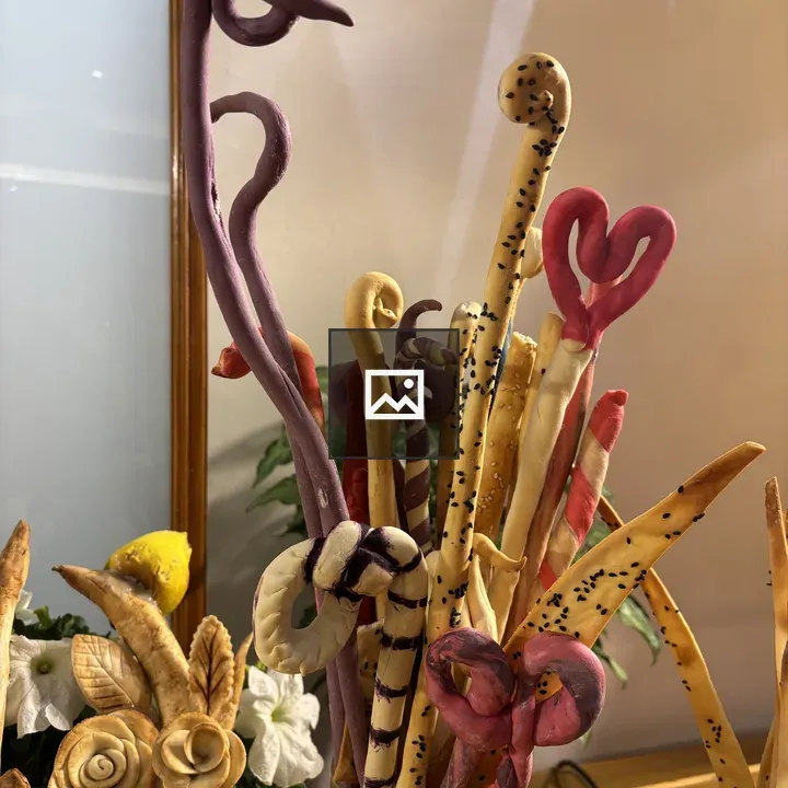 Colorful twisted sticks in vase