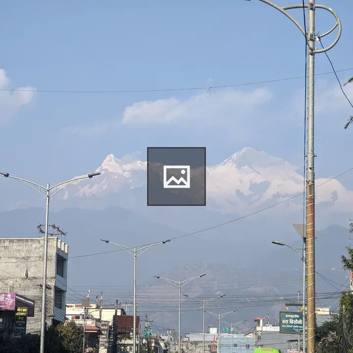 City street with mountains backdrop