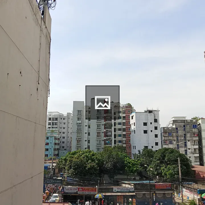 Busy urban street scene with buildings