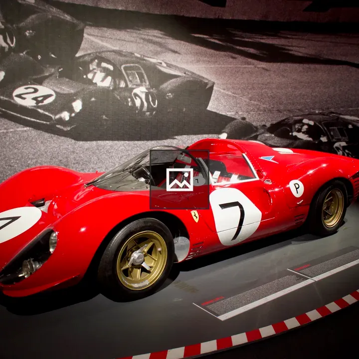 Red Vintage Race Car on Museum Platform