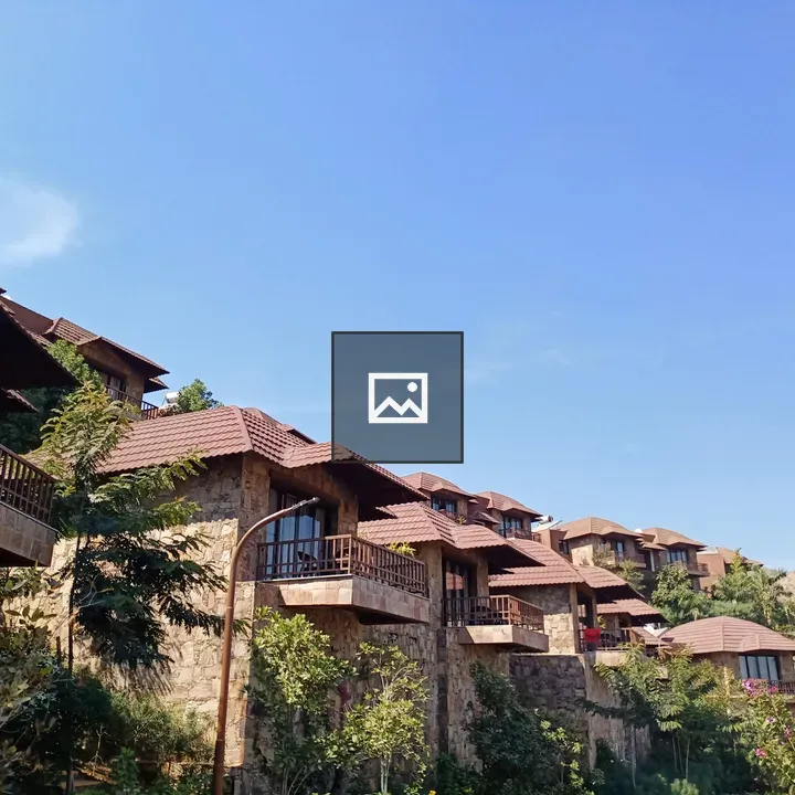 Row of Stone Houses with Brown Tile Roofs