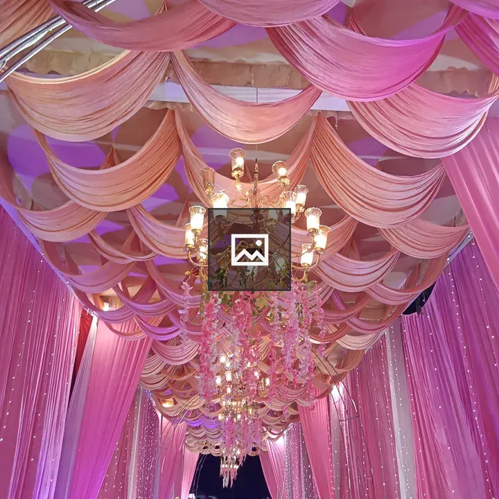 Chandelier with pink draperies