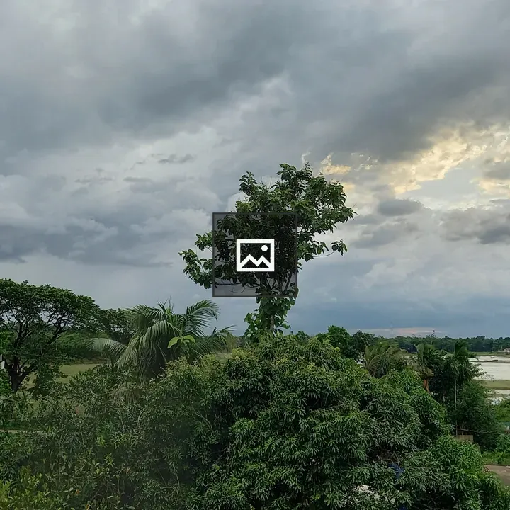 Green landscape under dusky skies
