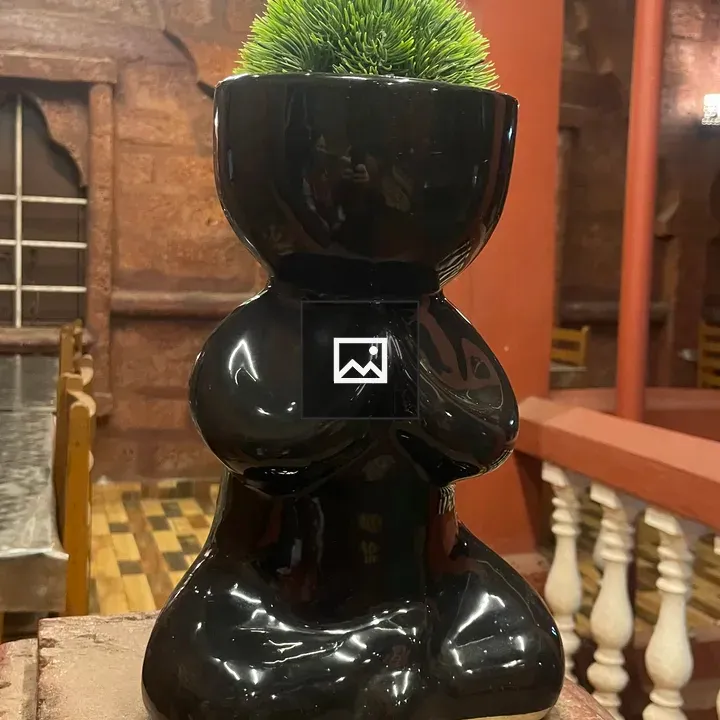 Black ceramic planter sculpture