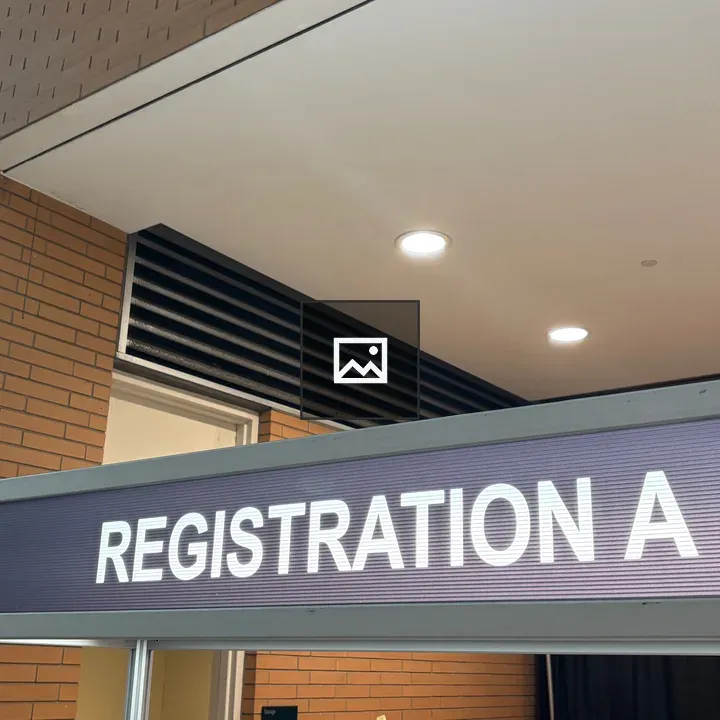 Registration A-J sign over desk