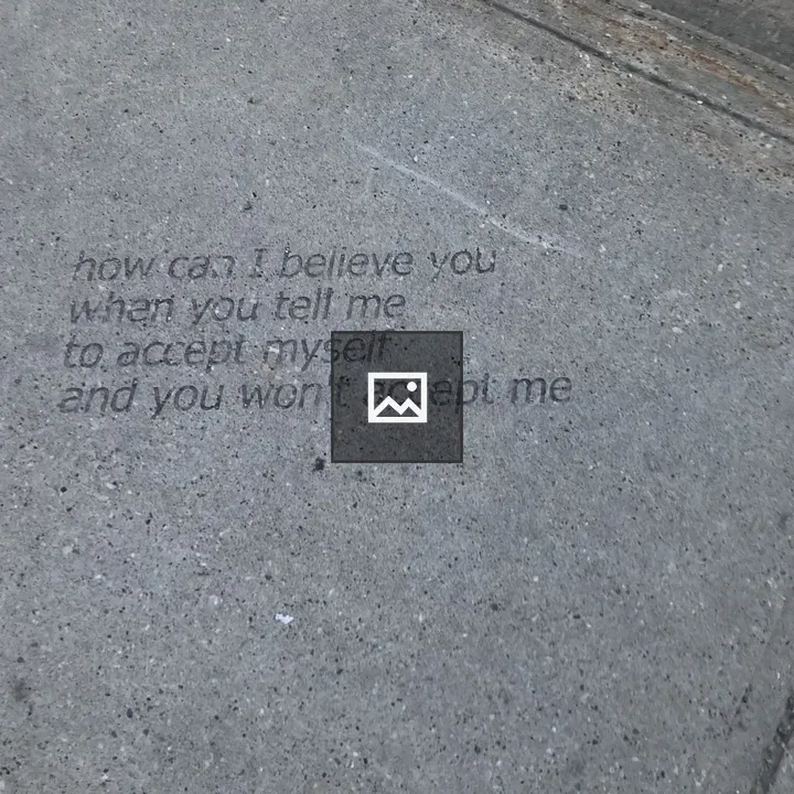 Sidewalk Segment with Graffiti Quote