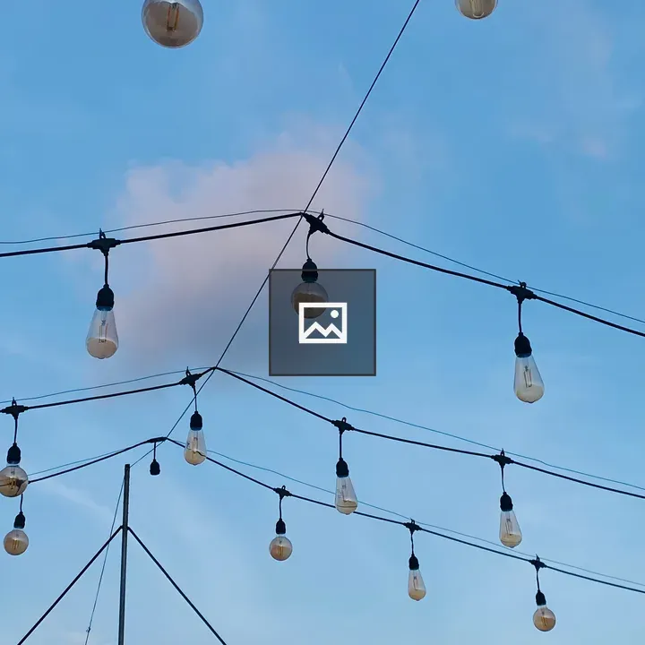 String lights against blue sky
