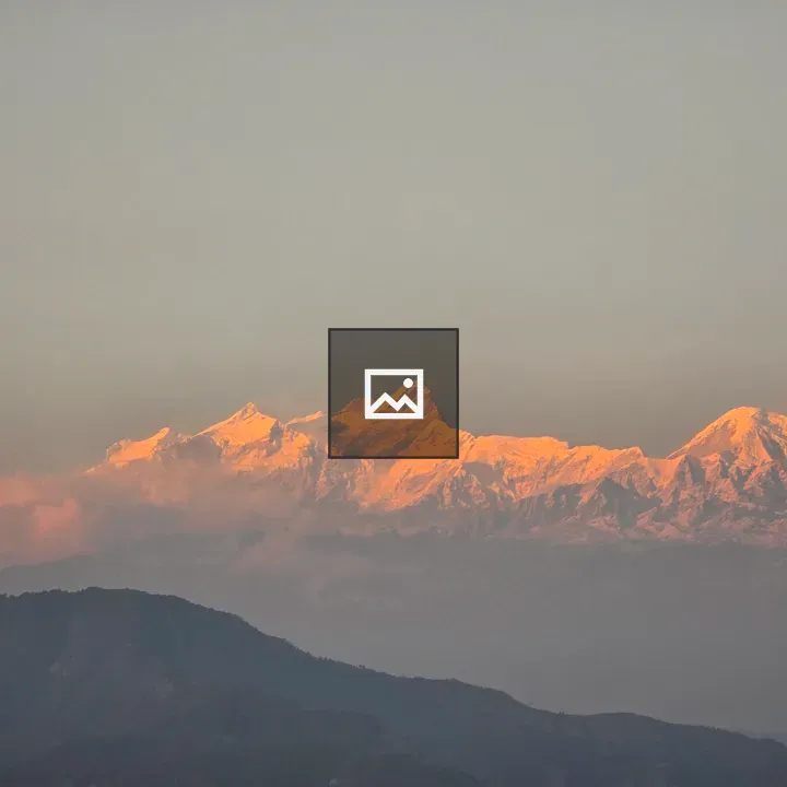 Snow-capped mountains at sunrise