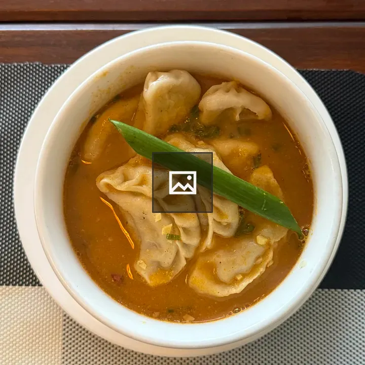 Spicy orange soup with dumplings