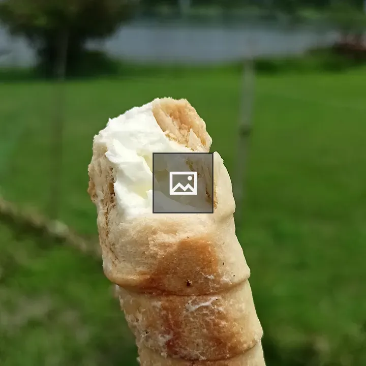 Hand holding cream roll