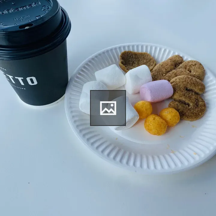Black coffee cup with snacks