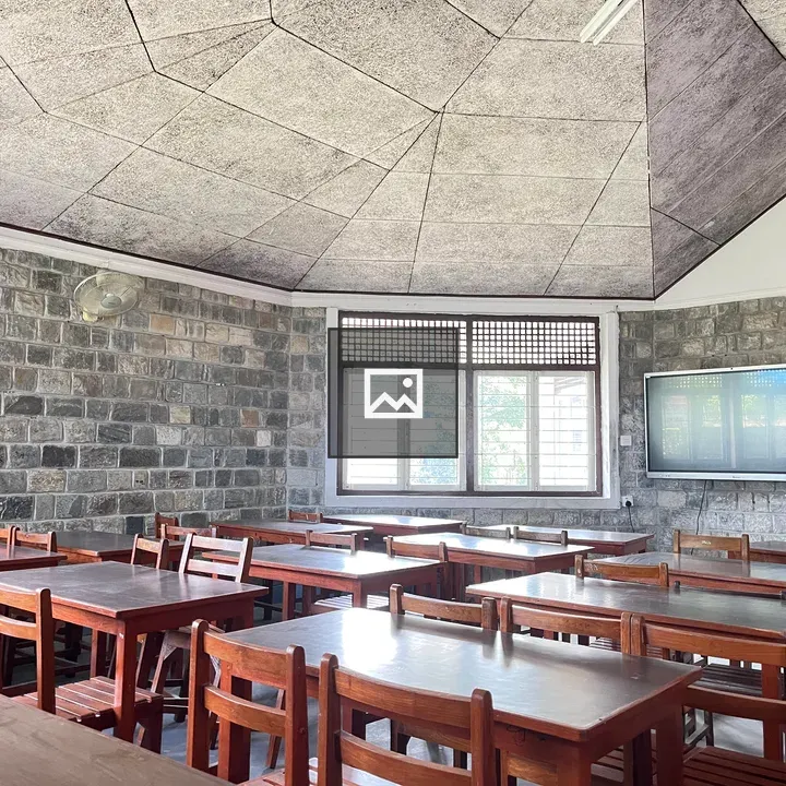 Classroom with stone walls and ceiling design