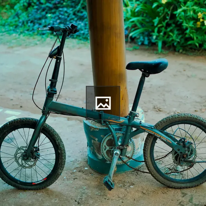 Old bicycle lean on fence post