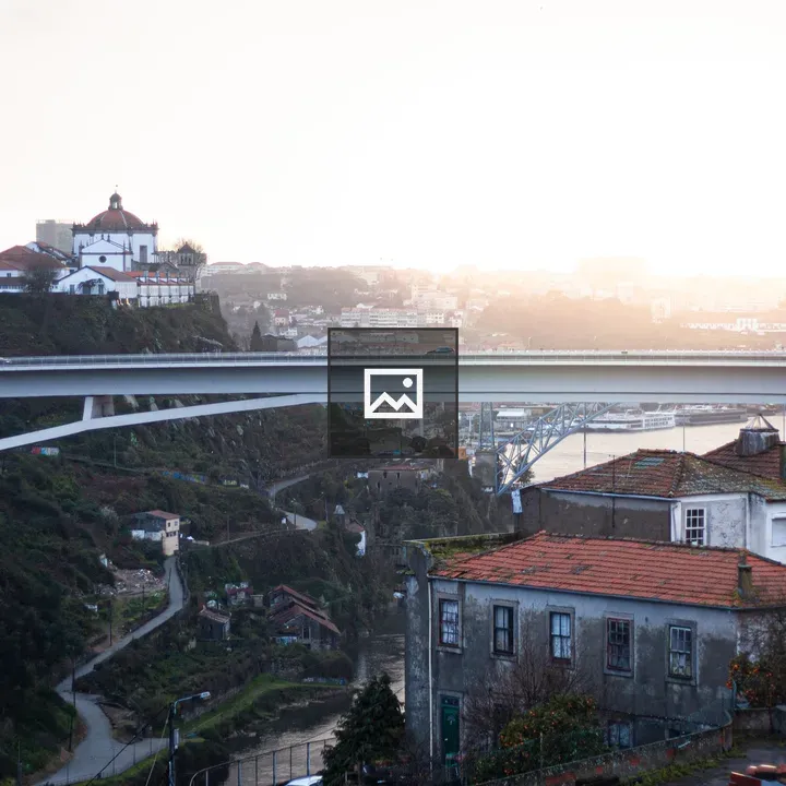 Sunset over Porto with red-roofed houses