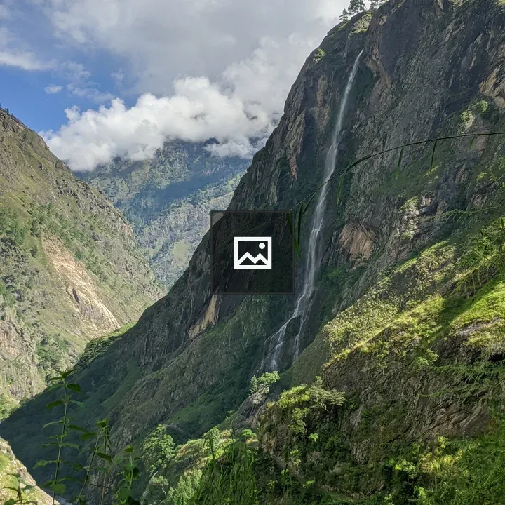 Mountainous landscape with waterfall