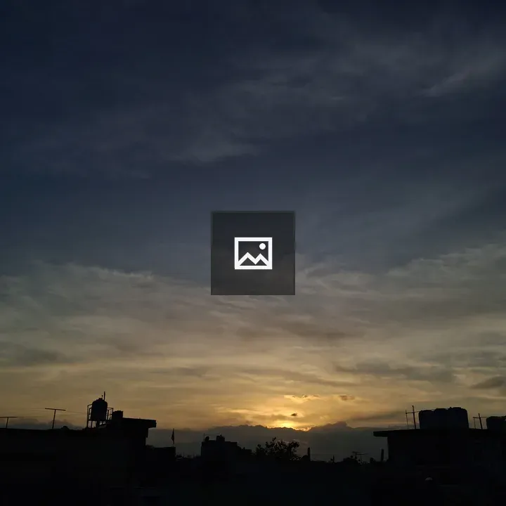 Sunset Over Rooftops and Antennas